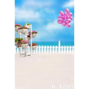 White Fence Pink Balloons Flowers by Seaside Beach Photo Background