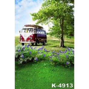 Tourist Bus in Green Grassland by Green Trees Photo Wall Backdrop